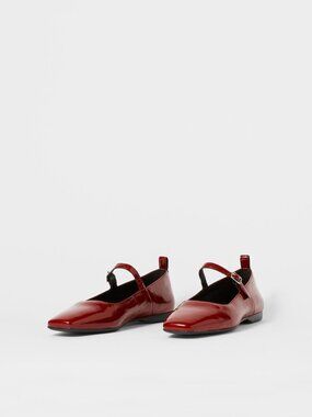 Red Vagabond Shoemaker Mary Jane flats.